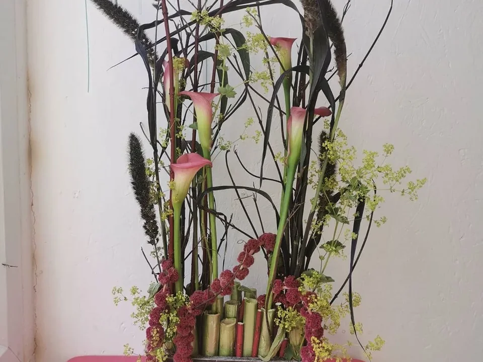 Sculptural pink and green event arrangement