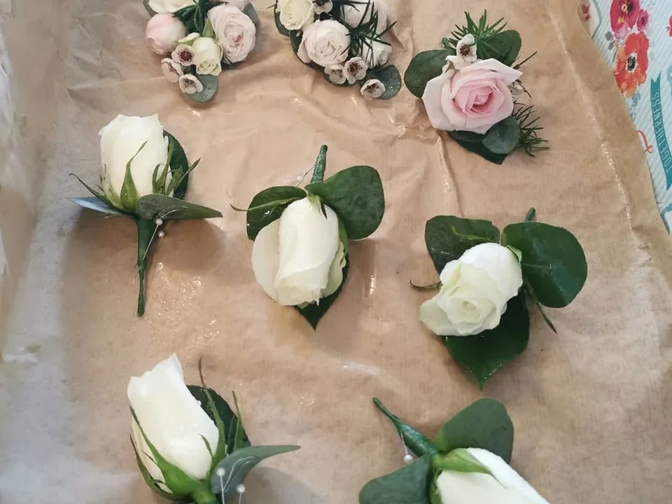 White rose wedding buttonholes