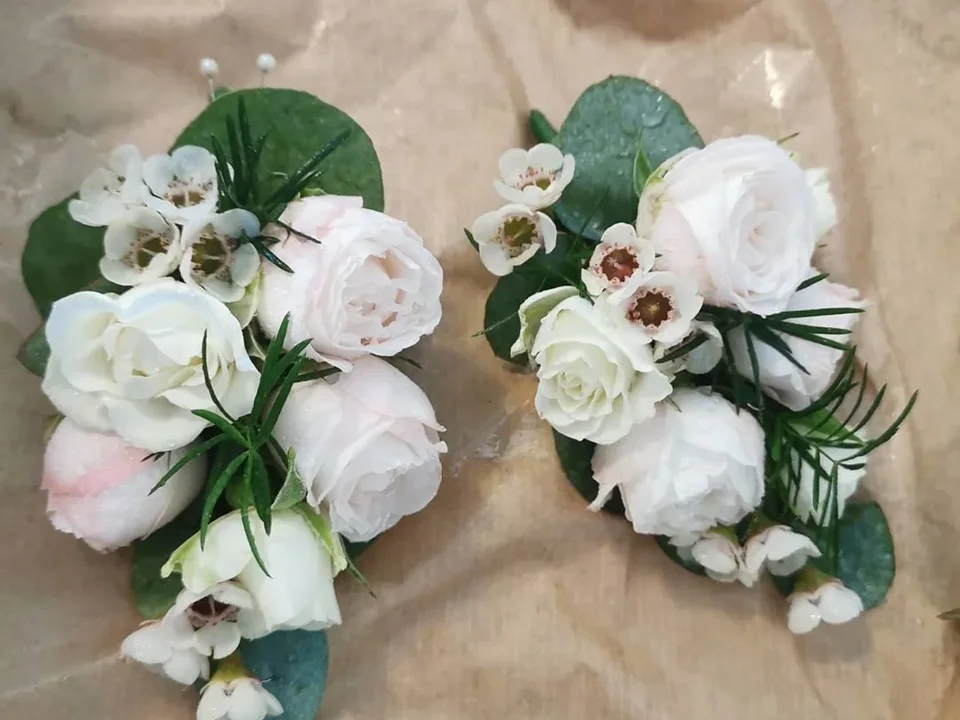 White floral corsages with eucalyptus