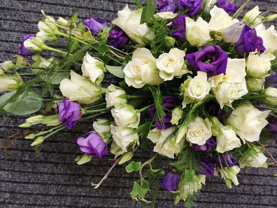 Purple and white hand-tied wedding bouquet