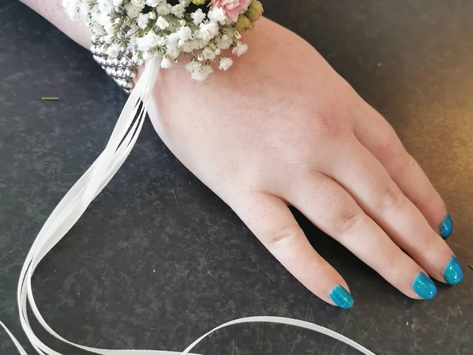 Delicate white floral wrist corsage